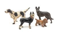 A Group of Four Painted Iron Door Stops Height of tallest 8 1/2 inches. — LATE 19TH CENTURY