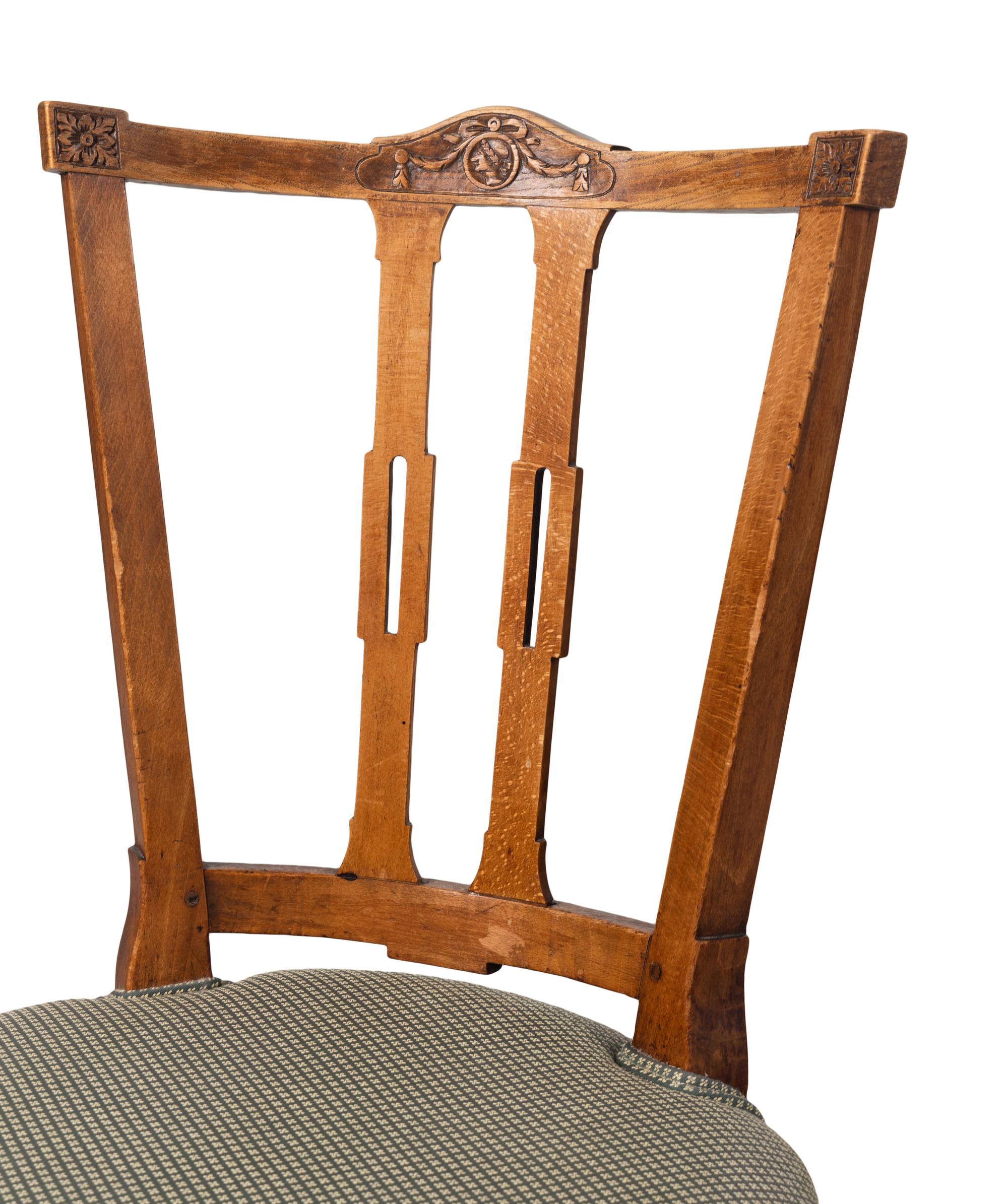 A Set of Four Dutch Fruitwood Dining Chairs