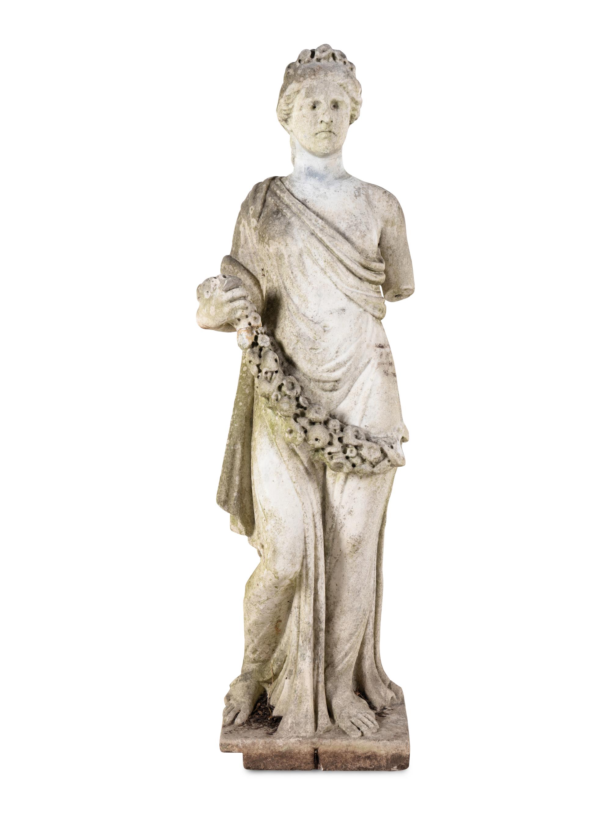 A Carved Marble Figure of a Maiden with Garlands