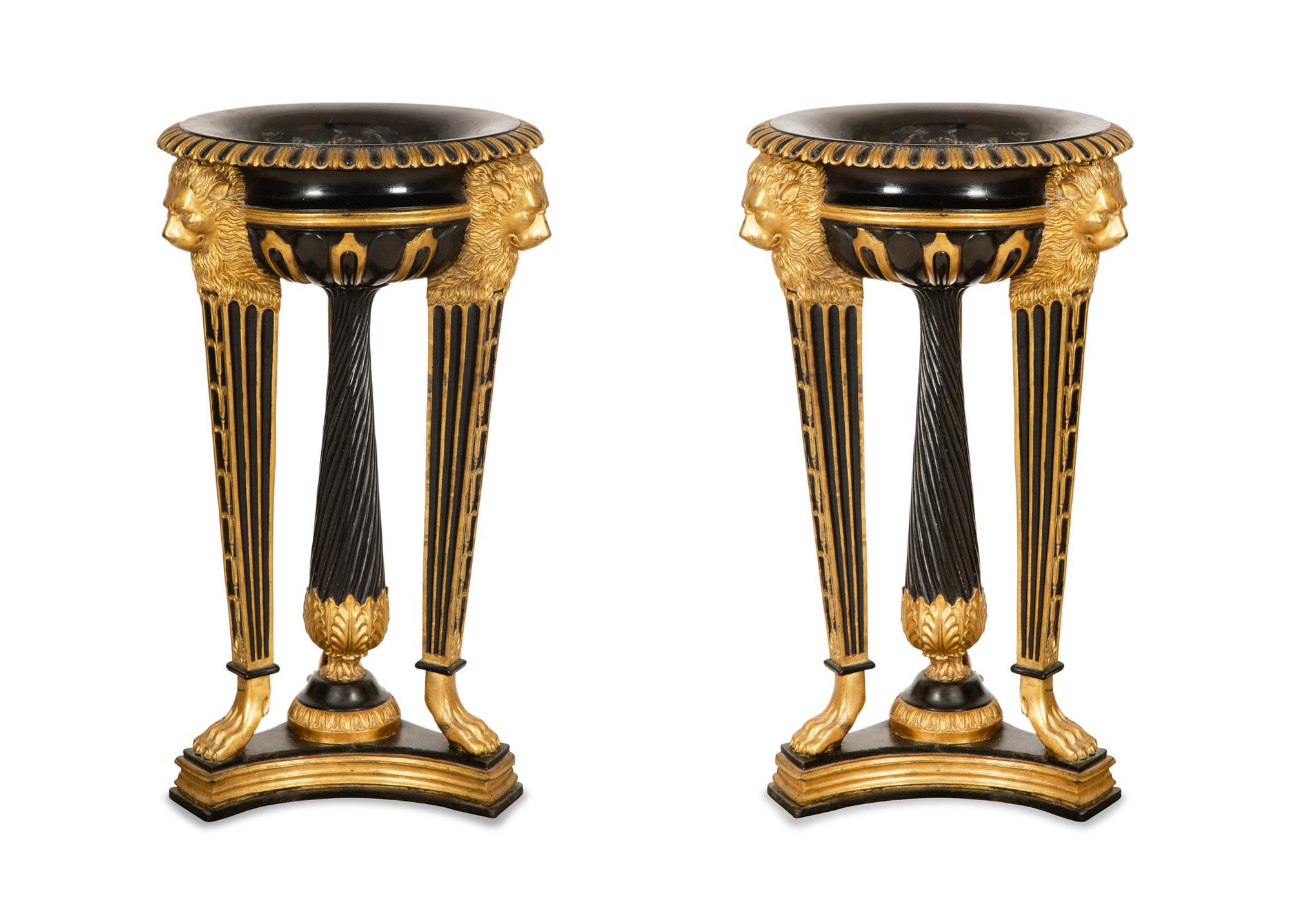 A Pair of Neoclassical Style Ebonized and Parcel Gilt Composition Jardinières on Stands