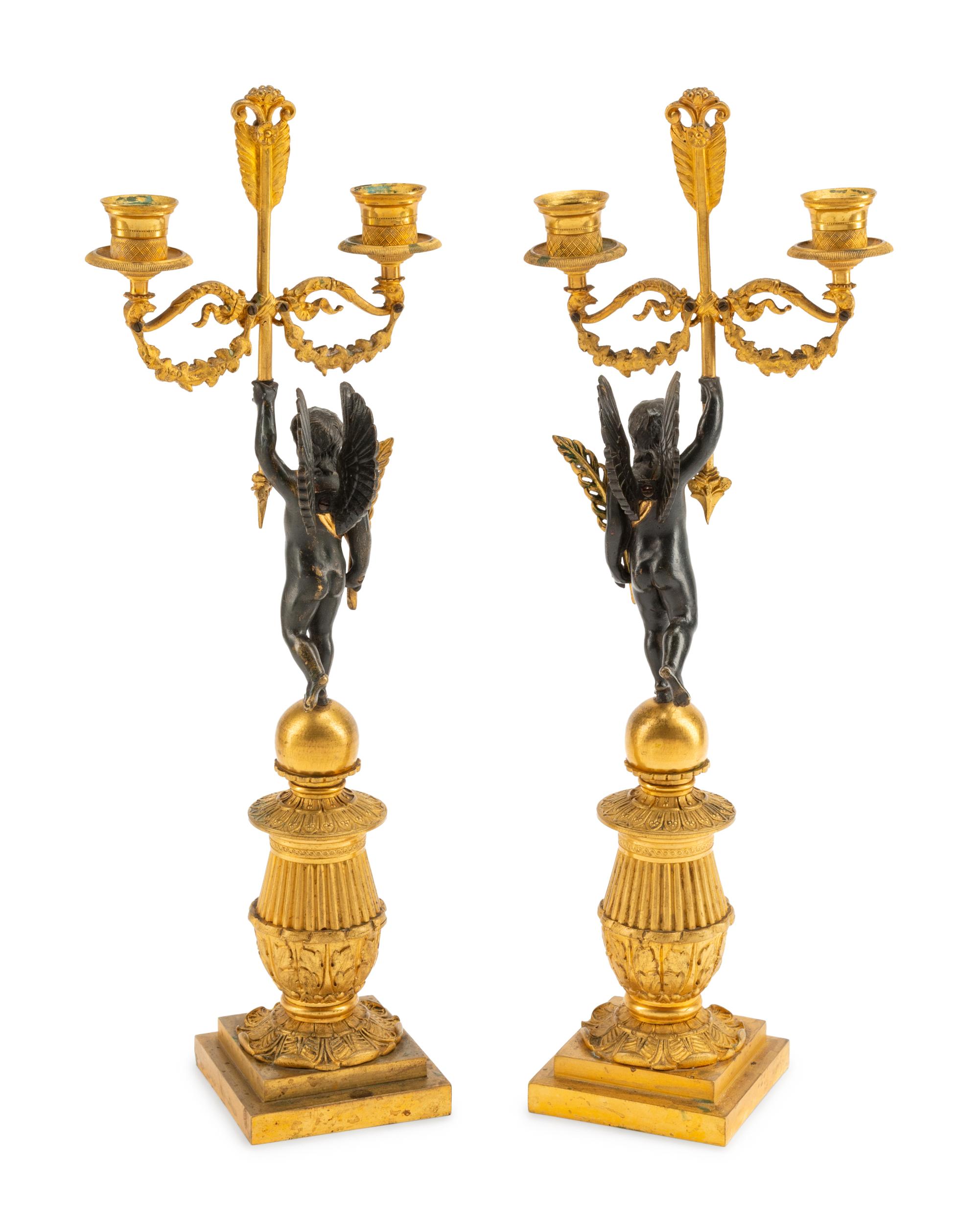 A Pair of Empire Style Gilt and Patinated Bronze Figural Two-Light Candelabra