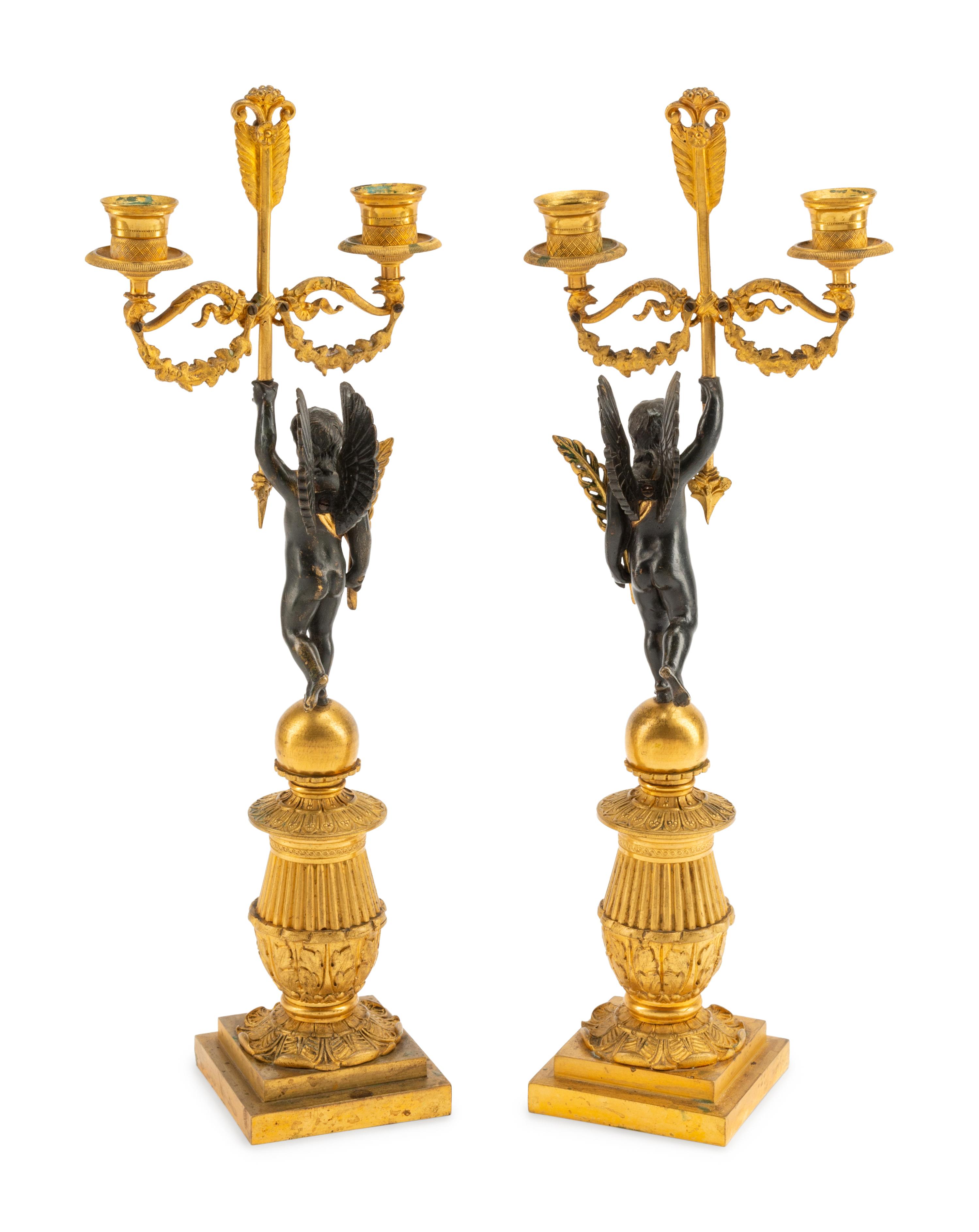 A Pair of Empire Style Gilt and Patinated Bronze Figural Two-Light Candelabra