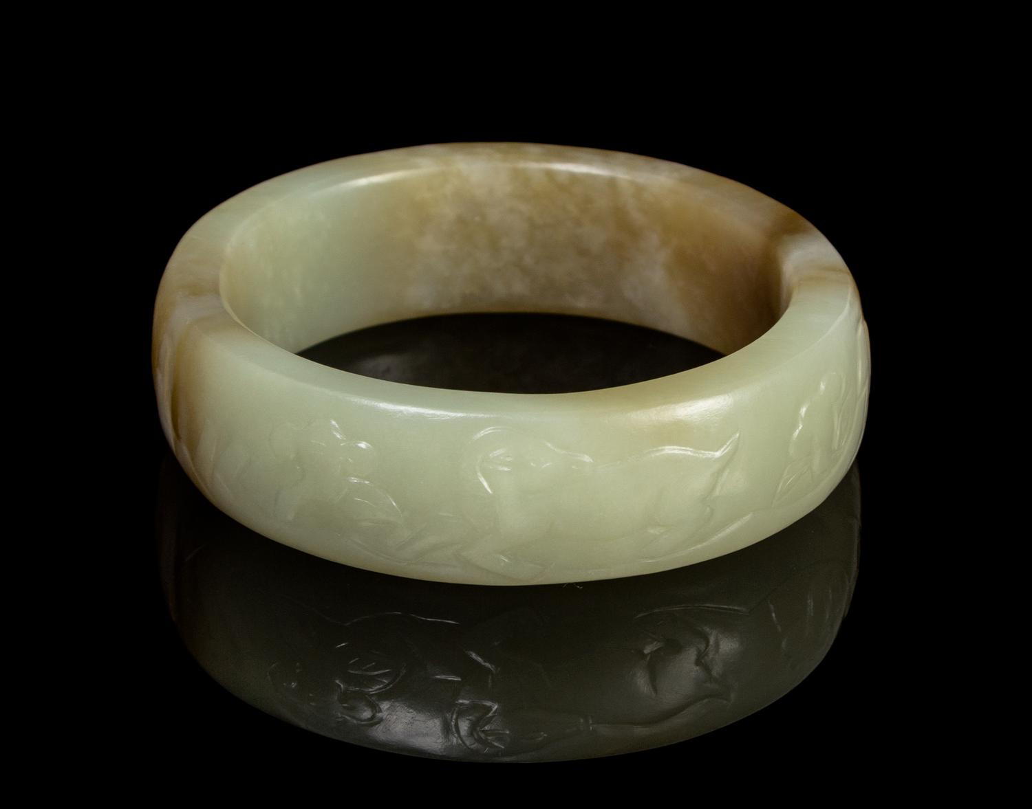 A Chinese White Jade Bangle LATE MING/EARLY QING DYNASTY Diameter overall 3 1/8 inches. — LATE MING/EARLY QING DYNASTY
