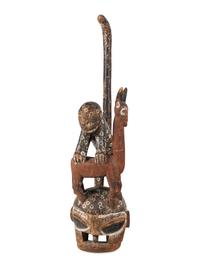 An African Carved and Painted Wood Monkey and Gazelle Figural Group