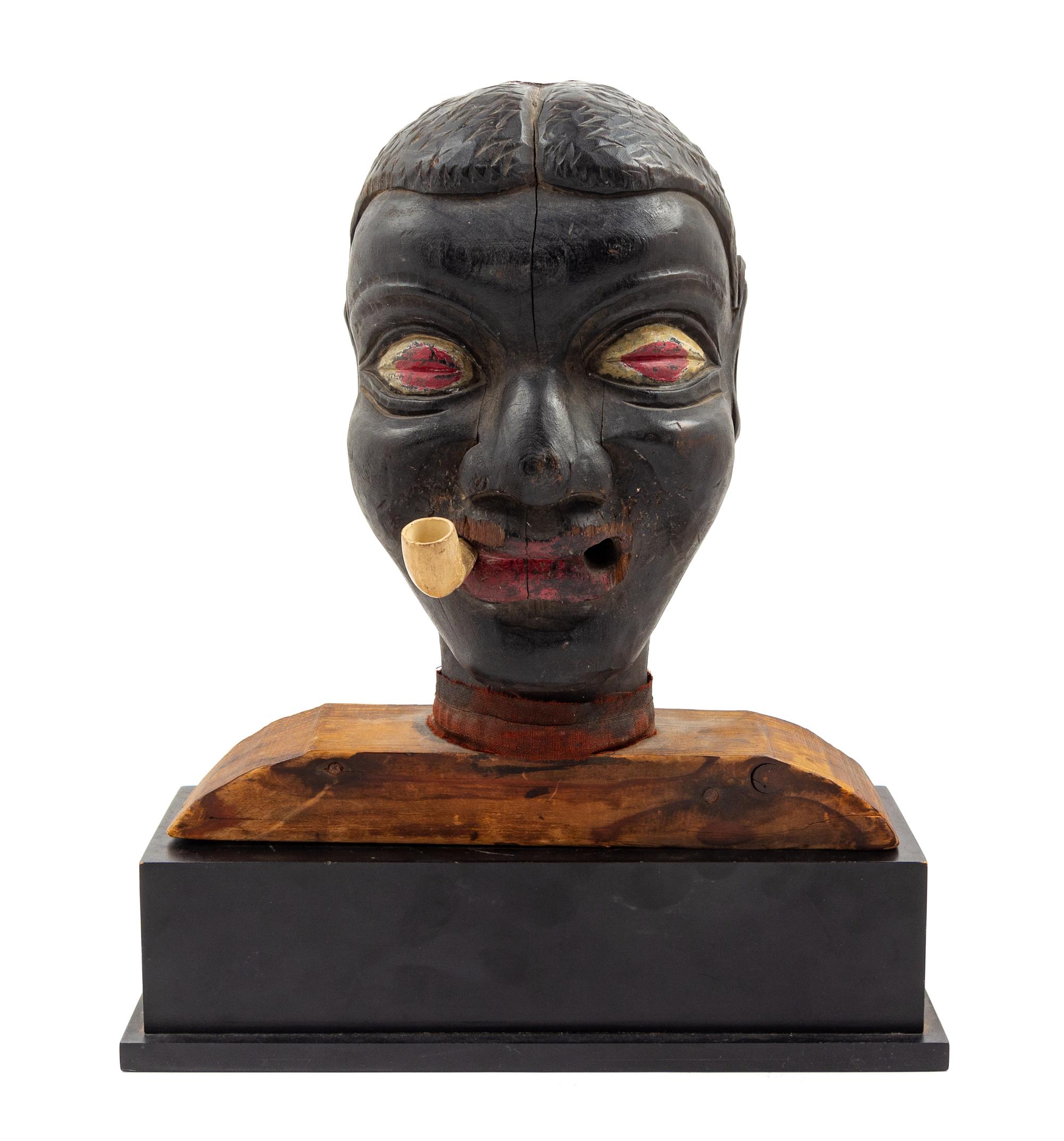 A Carved and Polychromed Figure of a Man Height 12 inches.