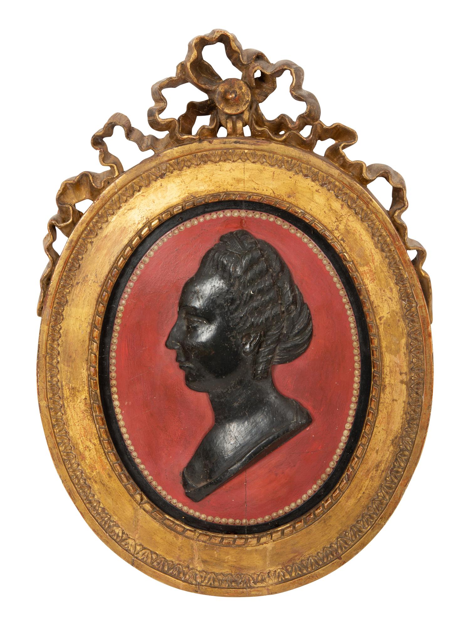 A Pair of Giltwood Framed Ebonized Relief Portrait Plaques of French Nobility, 18th Century