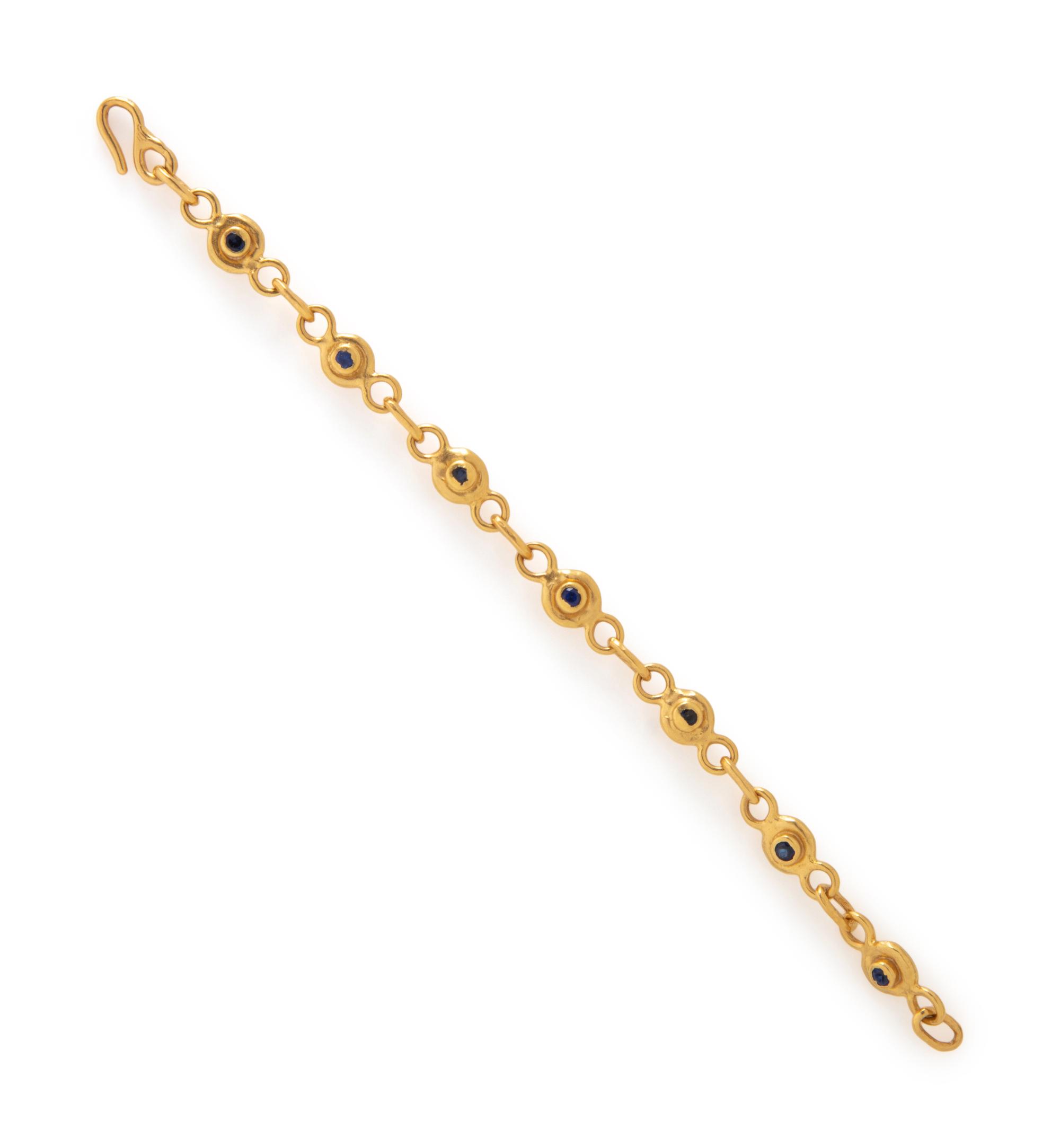 JEAN MAHIE, DIAMOND, SAPPHIRE, AND HIGH KARAT GOLD BRACELET