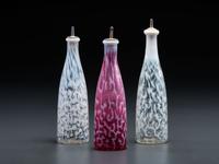 Three Coral Opalescent Glass Barber Bottles