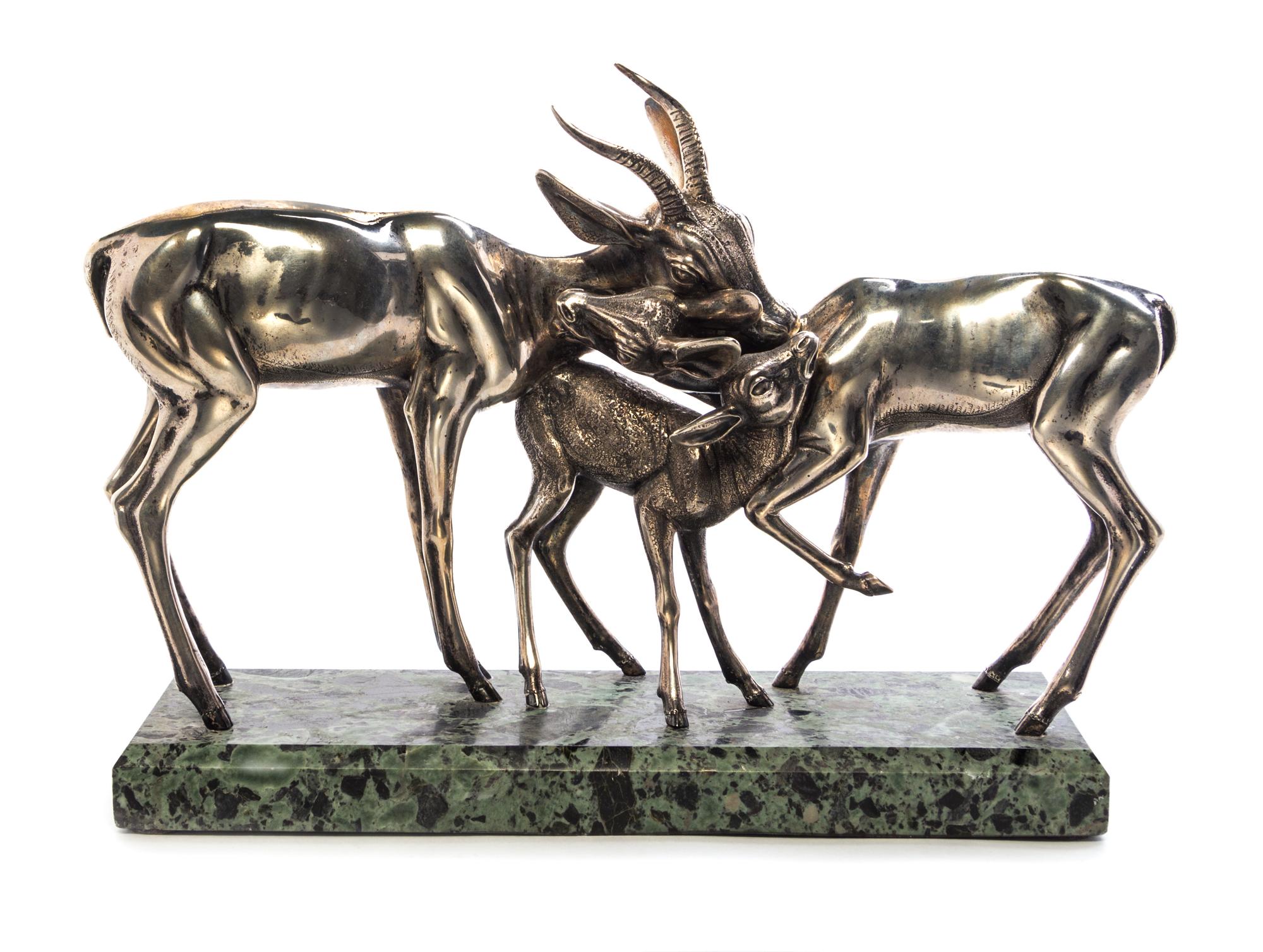 An Italian Silver Sculpture, Sirio Tofanari, Circa 1950, depicting two gazelles with their fawn, on a marble base.