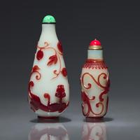 Two Chinese Ruby-Overlay Glass Bottles, Qing dynasty, Circa 1770-1880 — 1770-1880年 白地套寶石紅料螭龍紋鼻煙壺兩支
