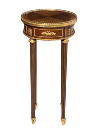 A Louis XVI Gilt Bronze Mounted Side Table