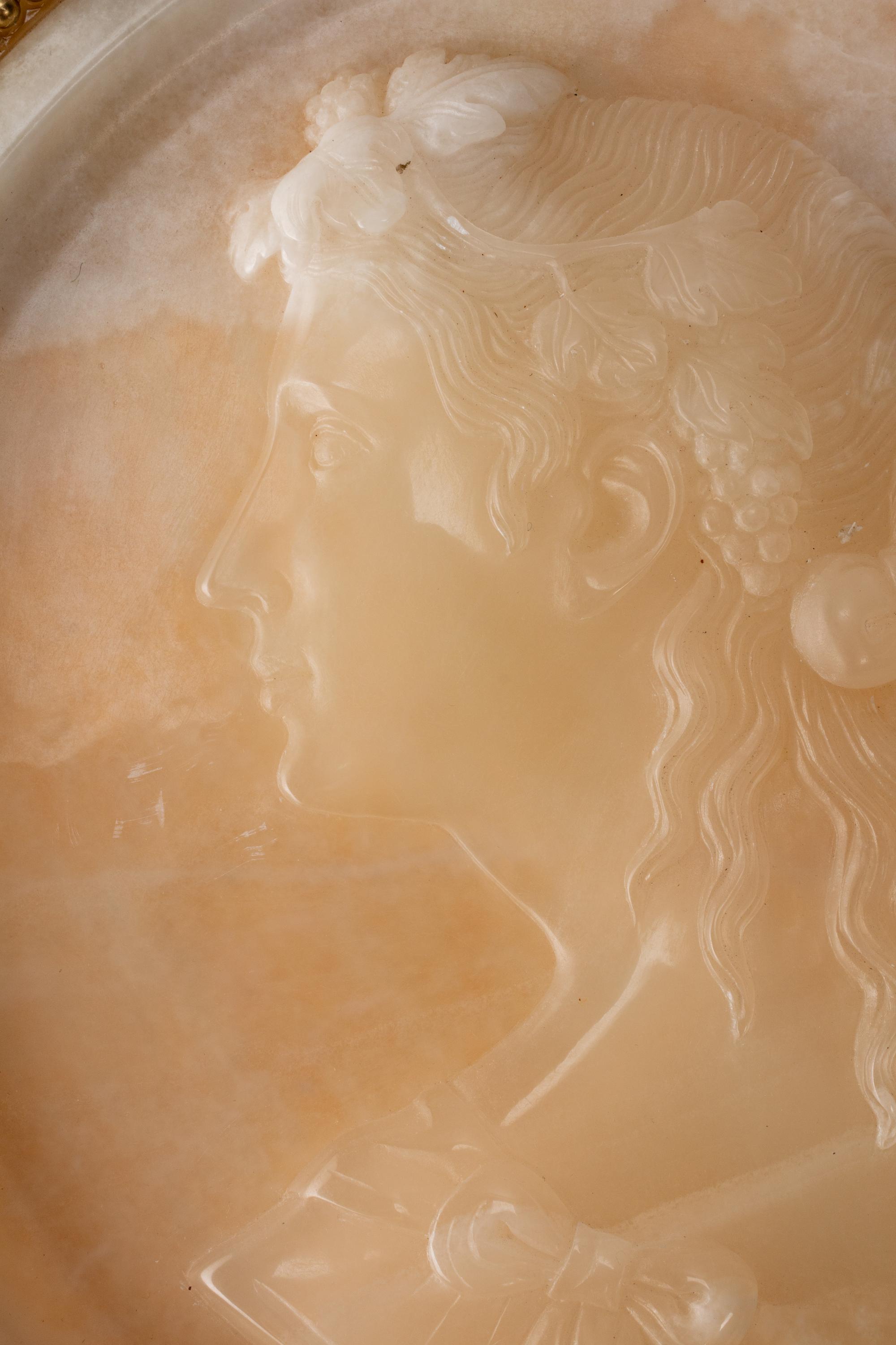 An Italian Carved Onyx Portrait Plaque in a Sienna Marble Frame