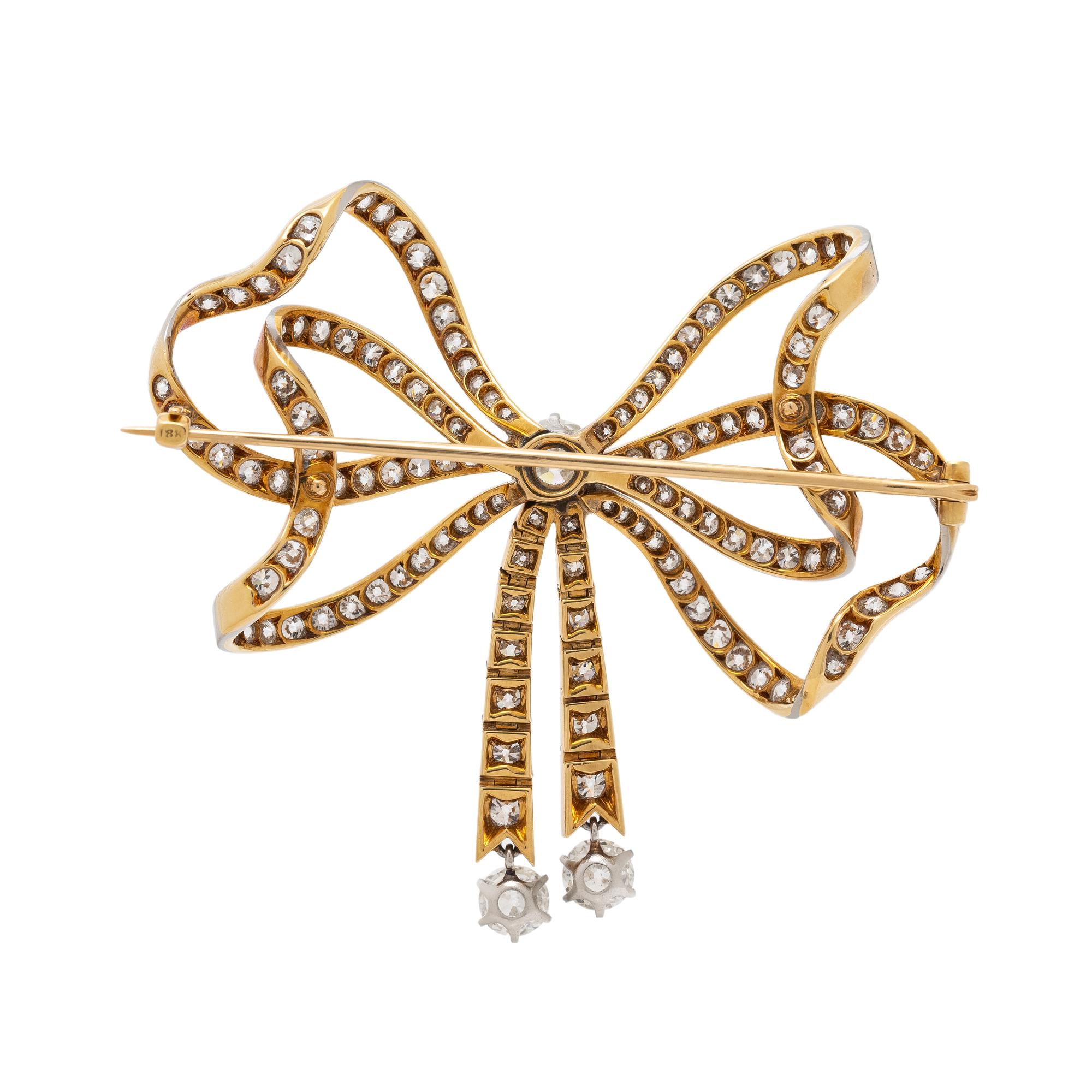 EDWARDIAN, DIAMOND AND PLATINUM-TOPPED GOLD BOW BROOCH