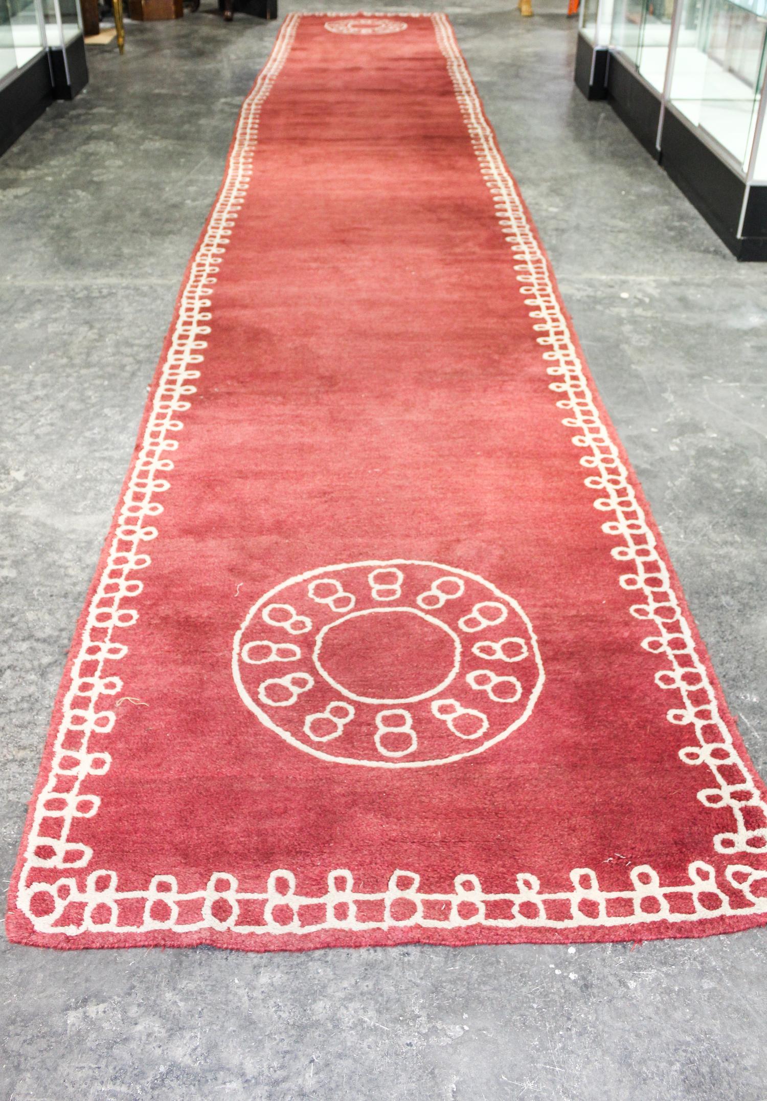 A Chinese Style Wool Rug 26 feet 2 1/2 inches x 4 feet 3 inches. — 20TH CENTURY