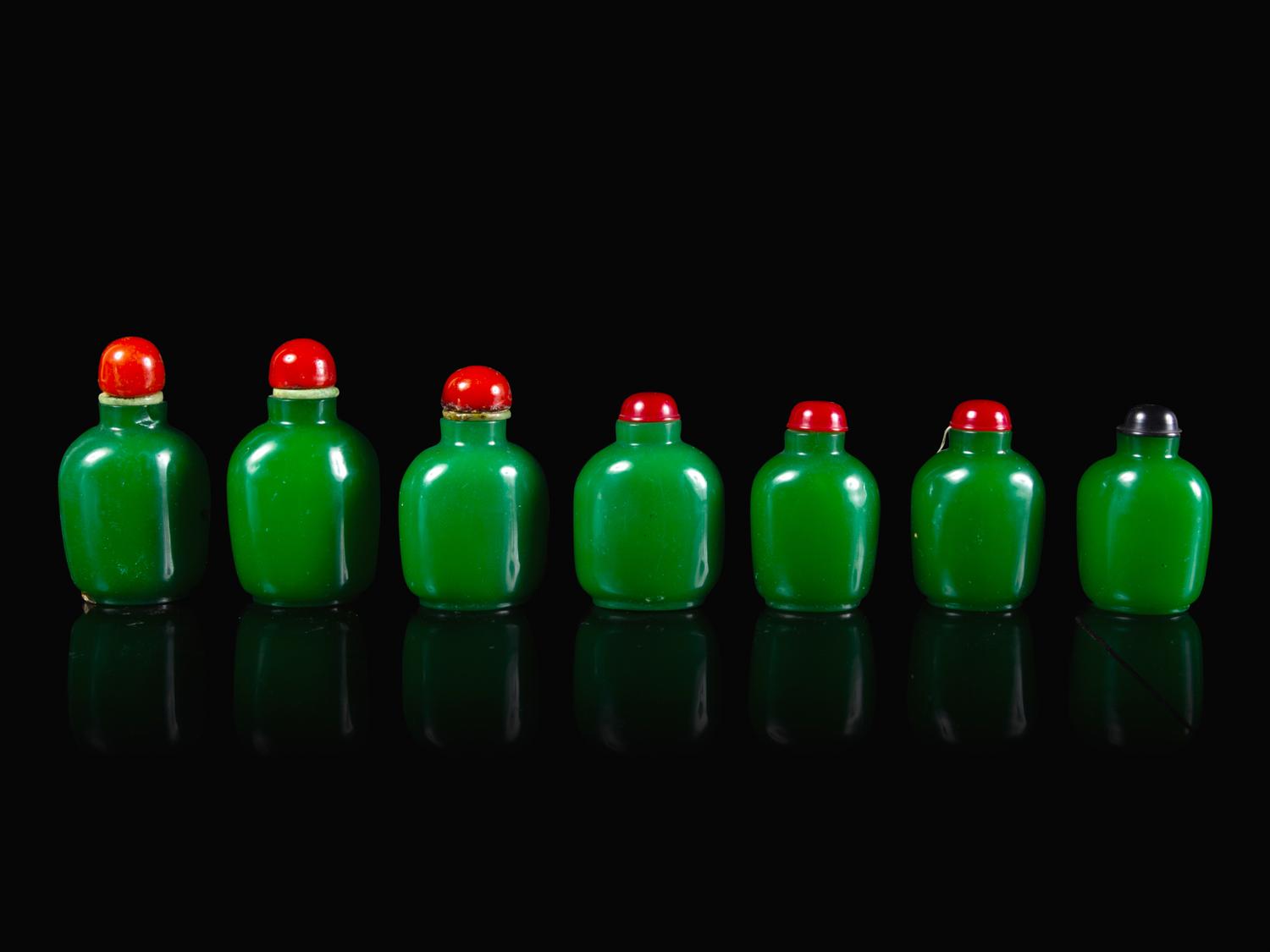 Seven Chinese Green Glass Snuff Bottles