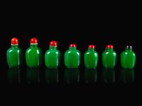 Seven Chinese Green Glass Snuff Bottles