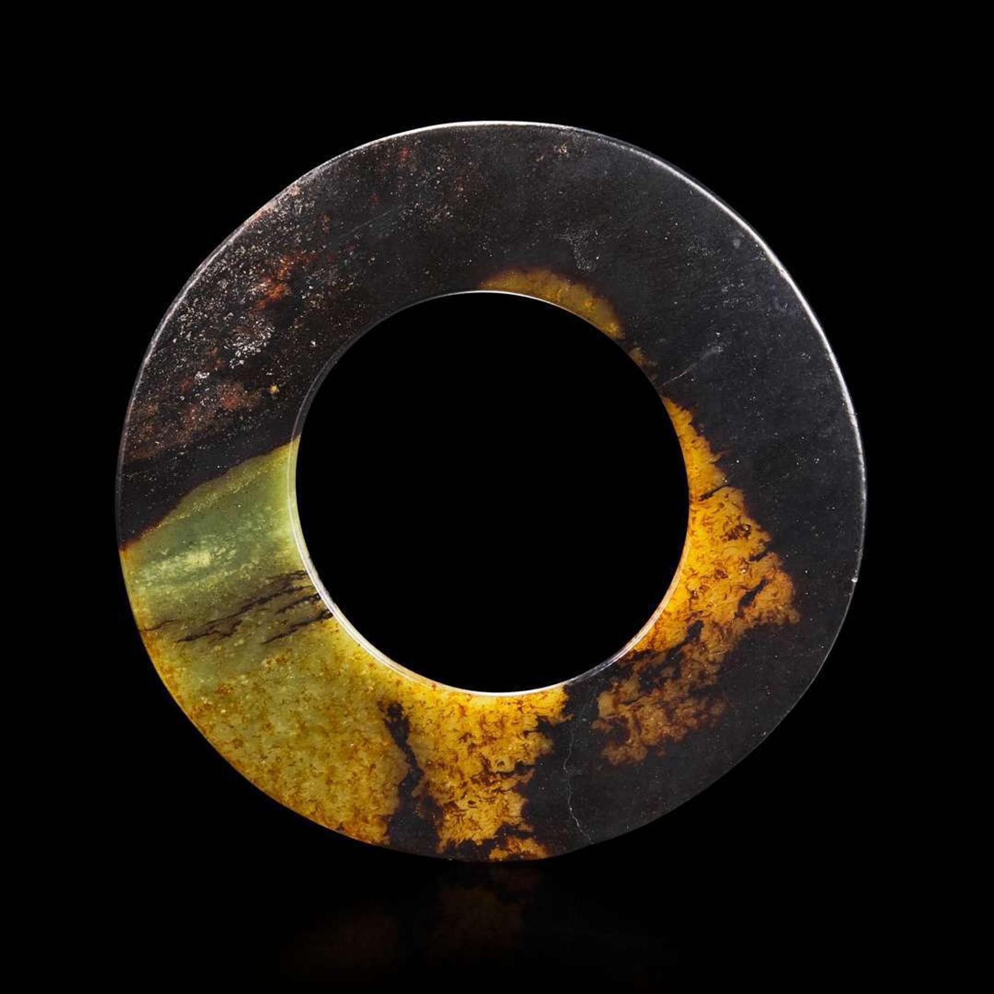 A Chinese brown and celadon jade Bi disk 玉璧 Probably Neolithic period ???????