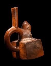 A Chimu-Inca Redware Stirrup Vessel with Squared Body and Human Figure