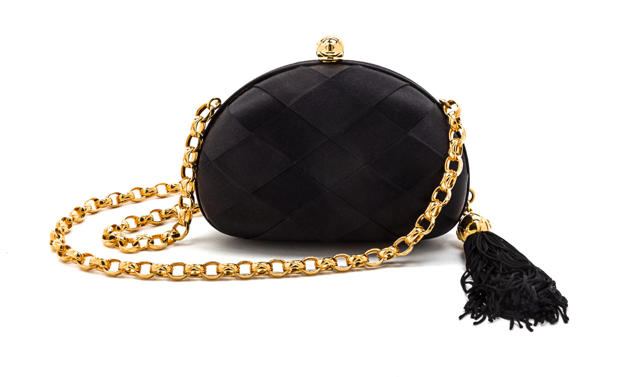 A Chanel Black Satin Basketweave Convertible Evening Bag, 6 x 4 x 2 inches.
