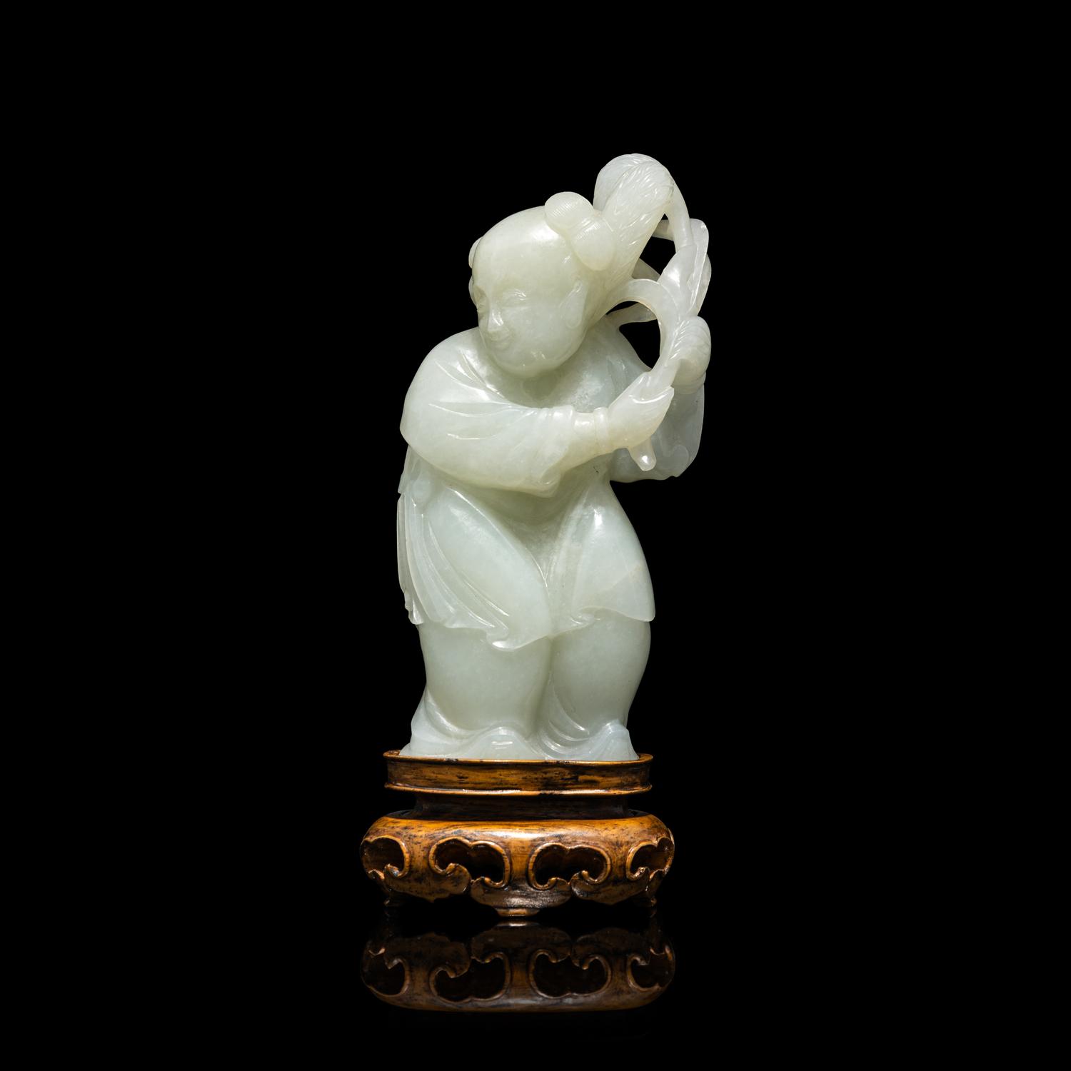 A Chinese Pale Celadon Jade Figure of a Boy, 18th-19th Century 清中期 青白玉 持蓮 童子