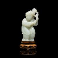 A Chinese Pale Celadon Jade Figure of a Boy, 18th-19th Century 清中期 青白玉 持蓮 童子
