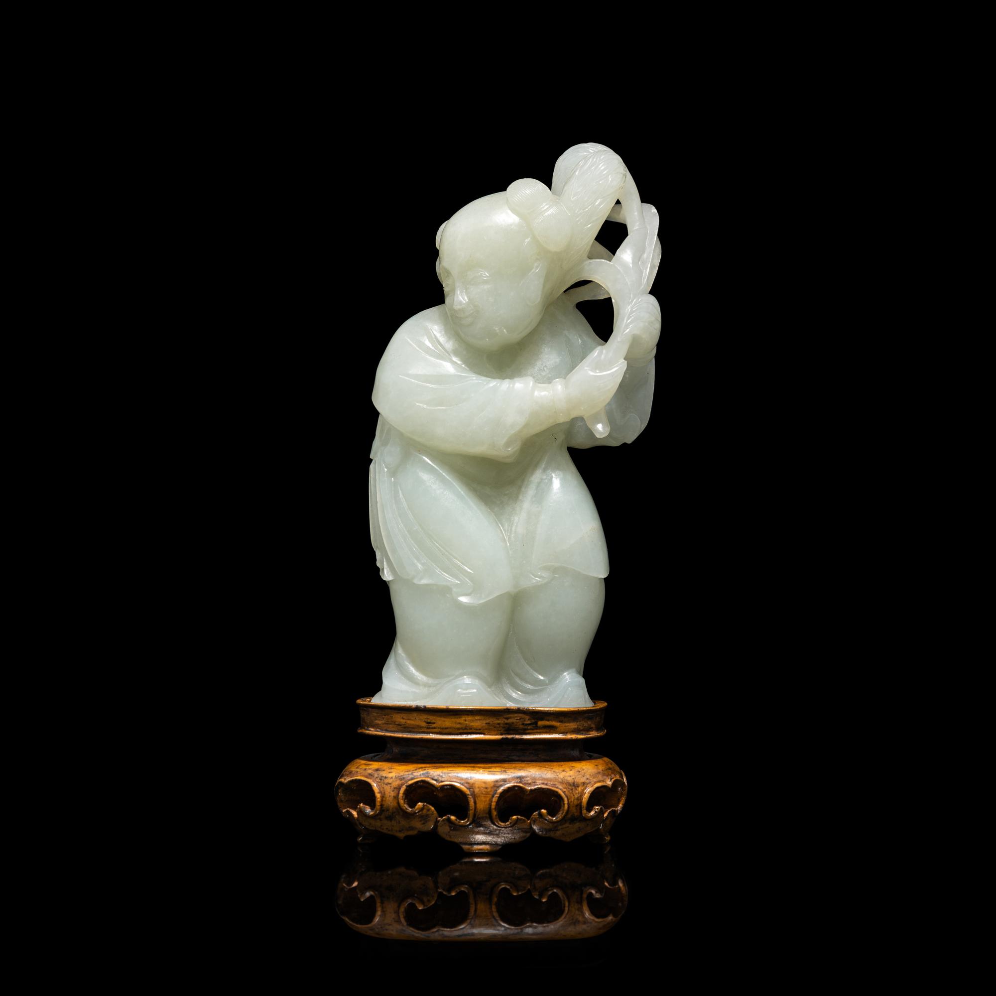 A Chinese Pale Celadon Jade Figure of a Boy, 18th-19th Century 清中期 青白玉 持蓮 童子