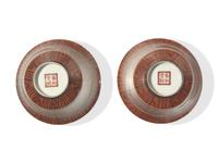 A Pair of Chinese Faux Bois Porcelain Erotic Tea Bowls, Covers, and Stands