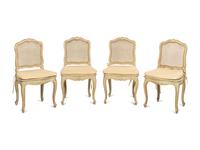 A Set of Four Louis XV Style Painted and Parcel Gilt Dining Chairs