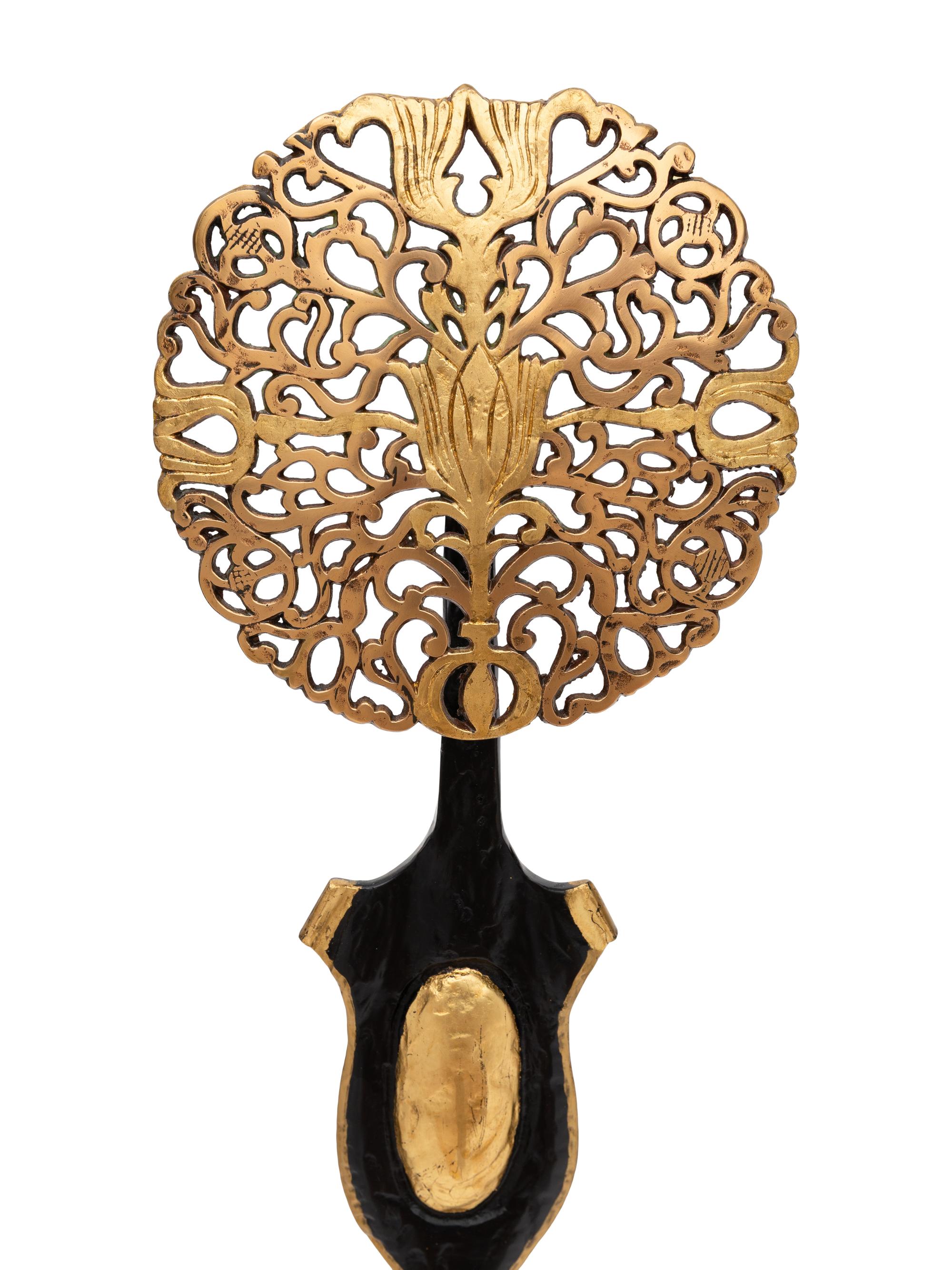 A Pair of Tudor Revival Parcel Gilt Wrought Iron Andirons