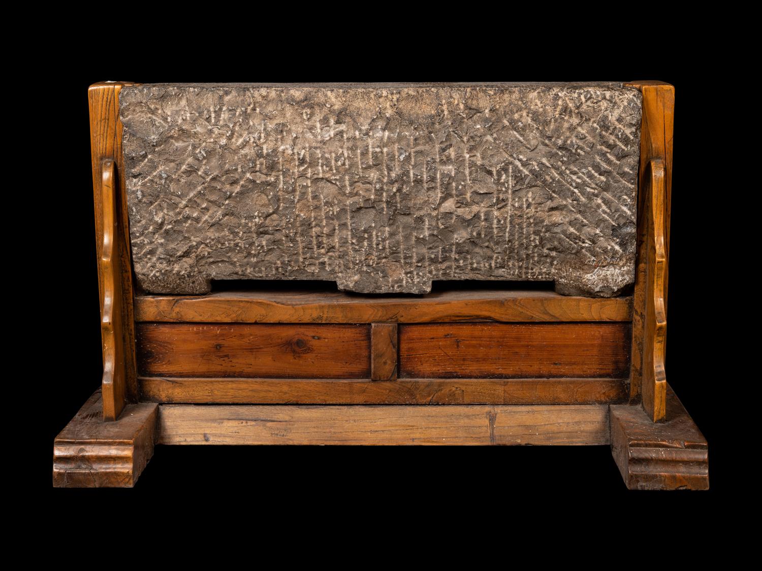 A Chinese Relief Carved Stone Stele Panel on Fitted Wood Stand