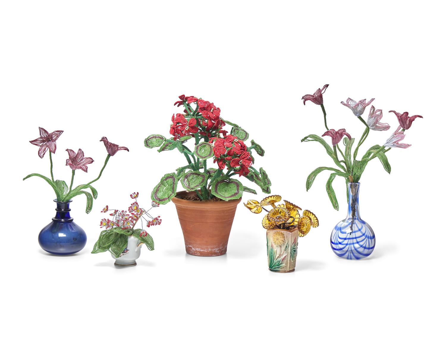 A Collection of Twenty-One French Beaded and Glass Flower and Fruit Arrangements