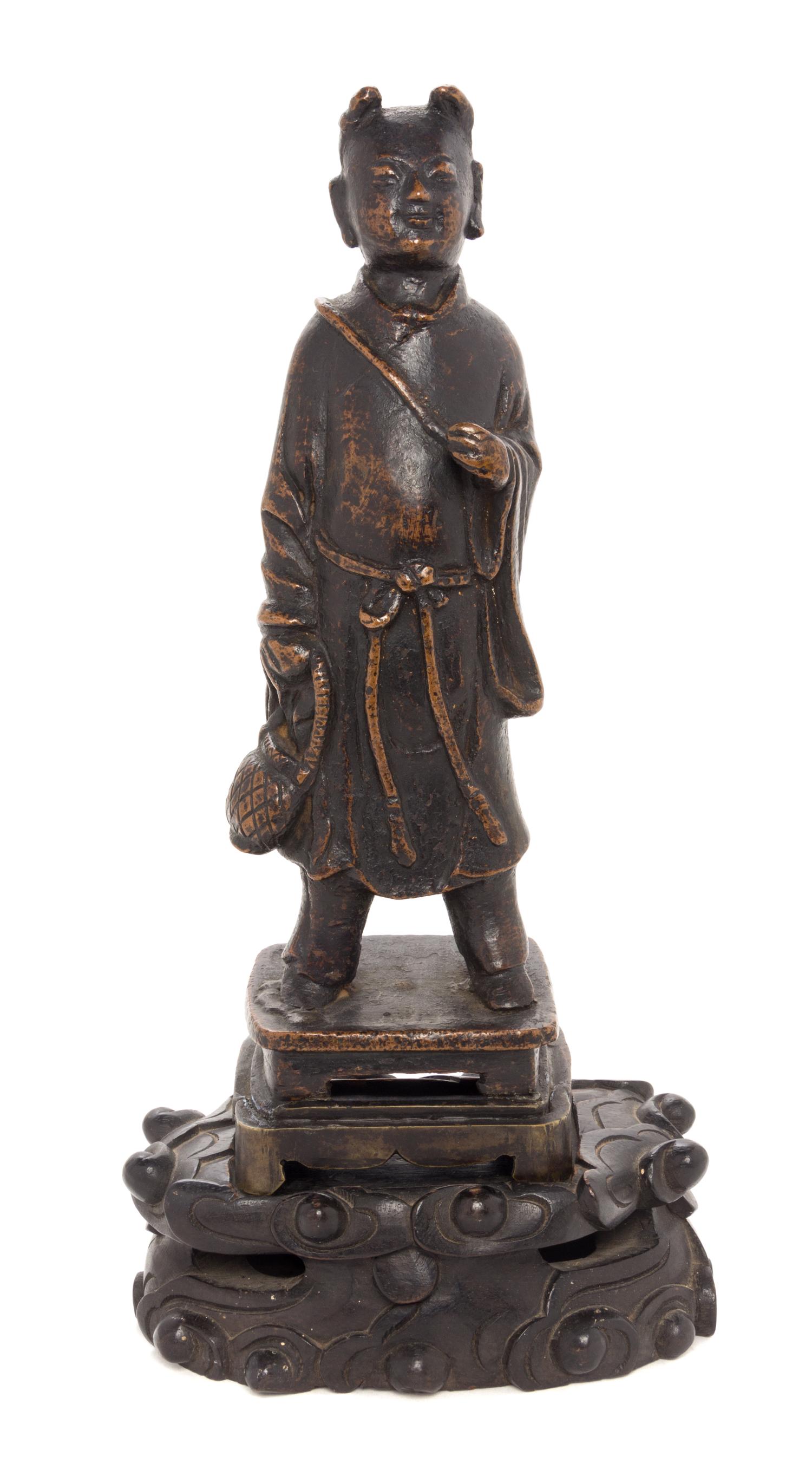 A Bronze Figure of a Young Buddhist Monk Height 5 1/2 inches. — MING DYNASTY