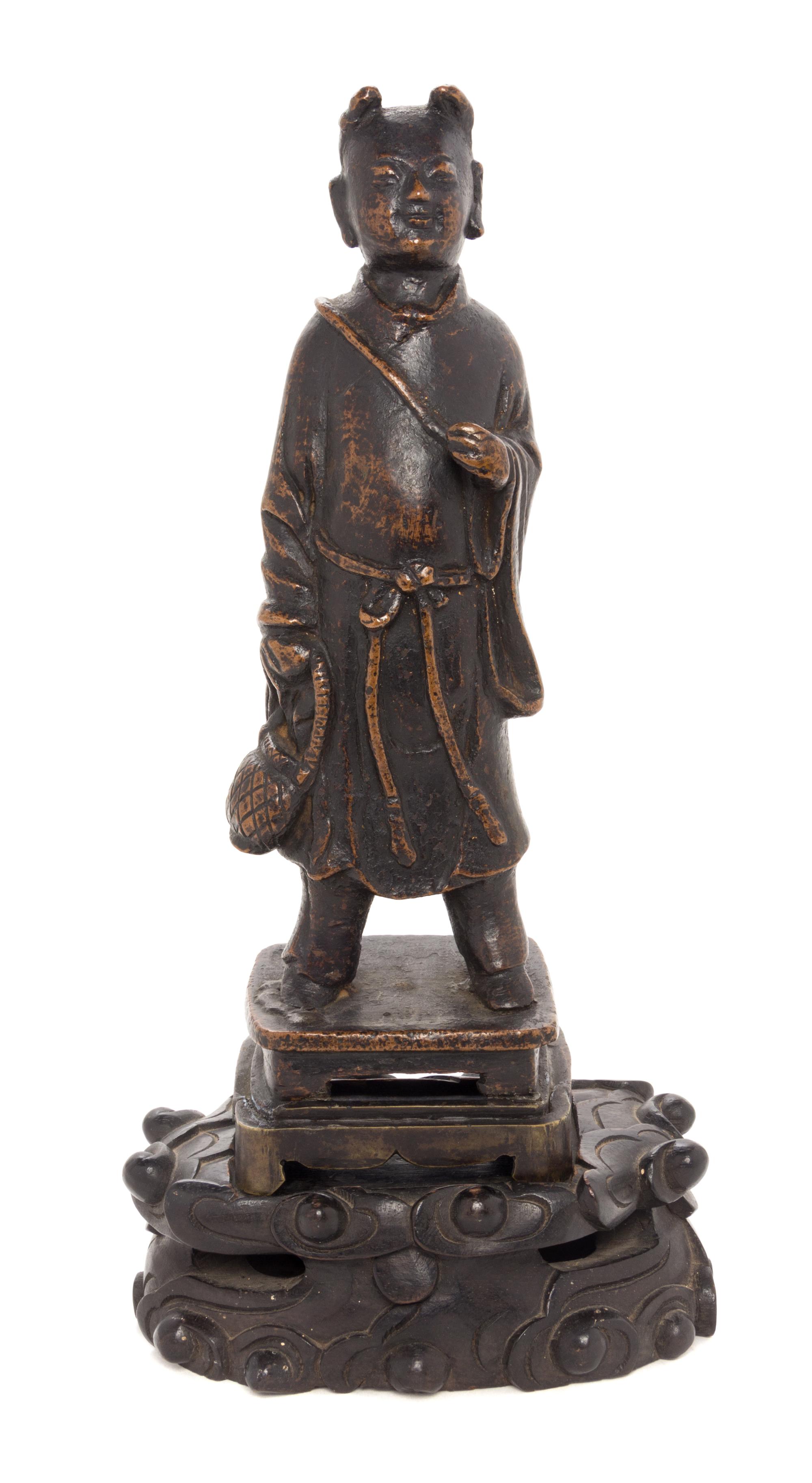 A Bronze Figure of a Young Buddhist Monk Height 5 1/2 inches. — MING DYNASTY