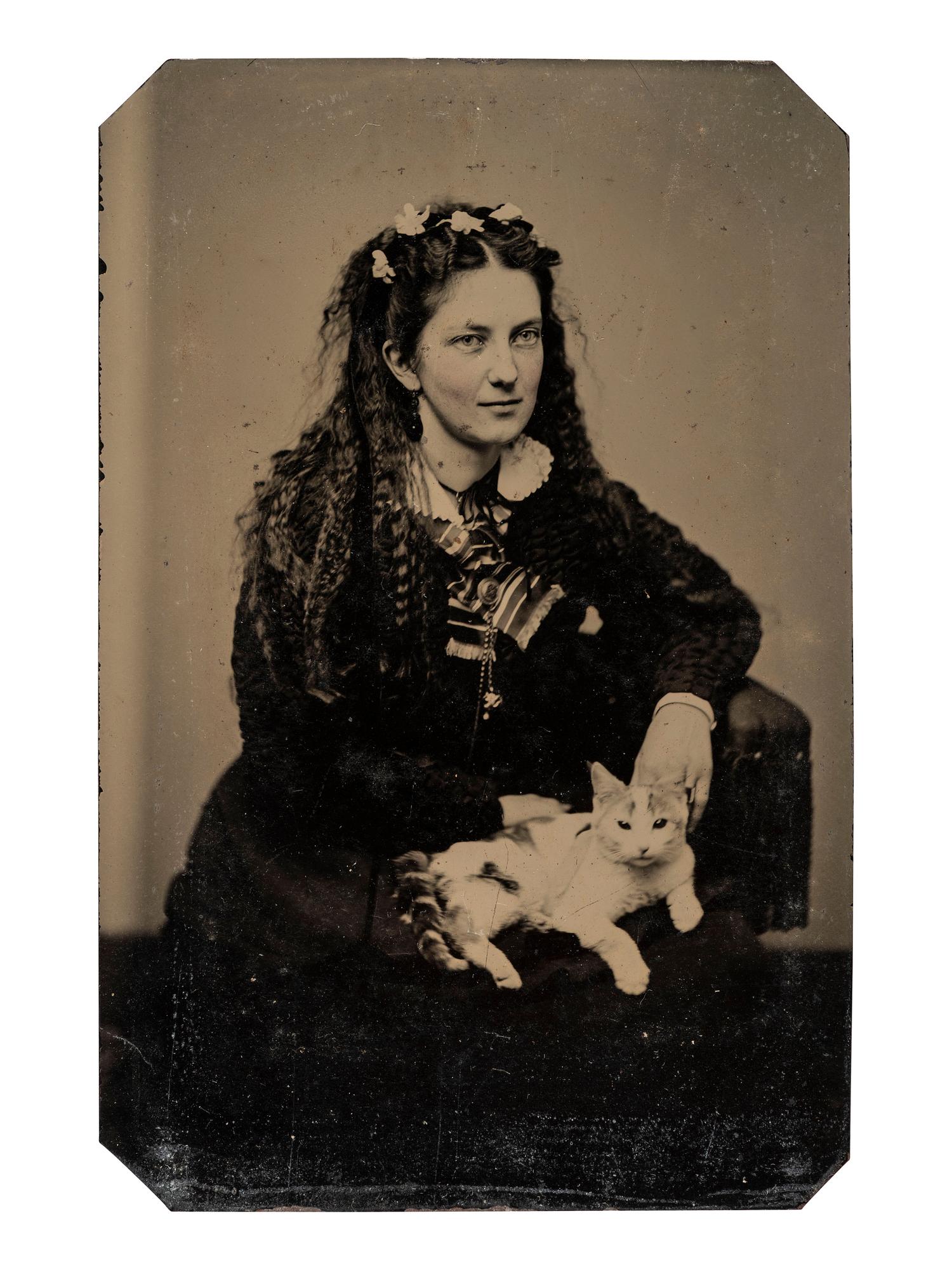 [EARLY PHOTOGRAPHY]. Tintypes of people with cats, incl. a charming portrait of 3 children and their feline friend by Hennigar of Lambertville, NJ.