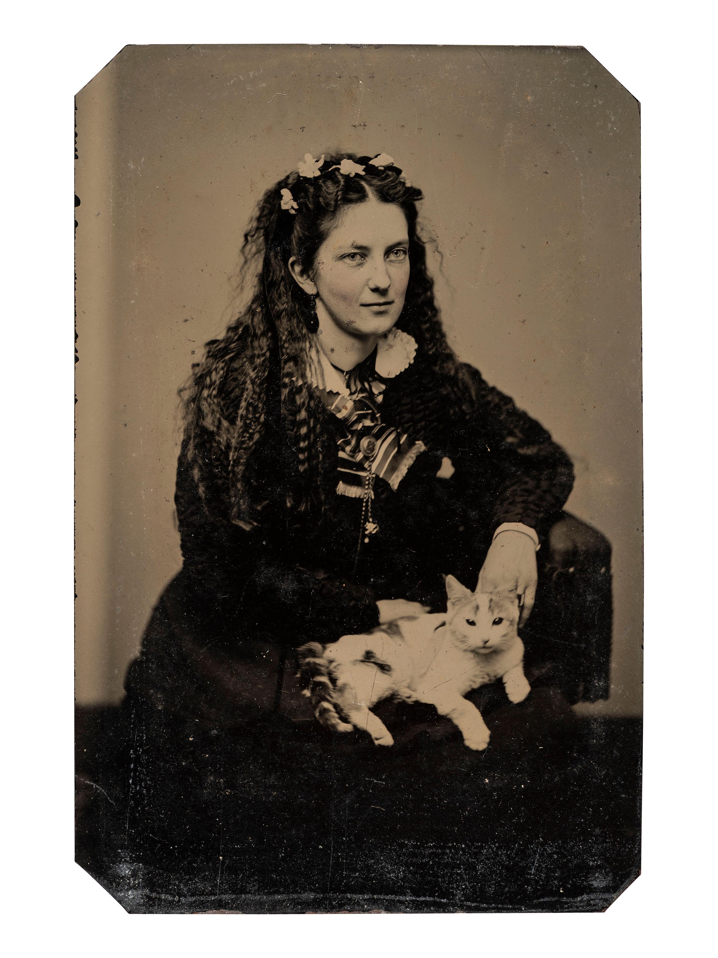 [EARLY PHOTOGRAPHY]. Tintypes of people with cats, incl. a charming portrait of 3 children and their feline friend by Hennigar of Lambertville, NJ.