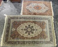 A Tabriz Wool Rug Larger: 7 feet 3 inches x 4 feet 8 inches.