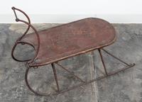 A Painted Wood and Metal Sled. Length overall 33 1/2 inches.