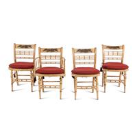 A Set of Four Classical Cream-Painted and Parcel Gilt "Hitchcock" Dining Chairs