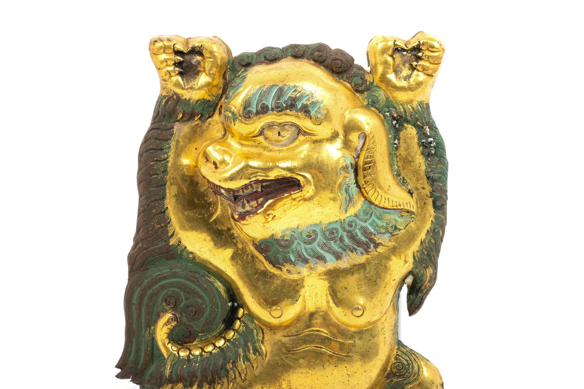 A Sino-Tibetan Gilt Bronze Repoussé Fu-Lion