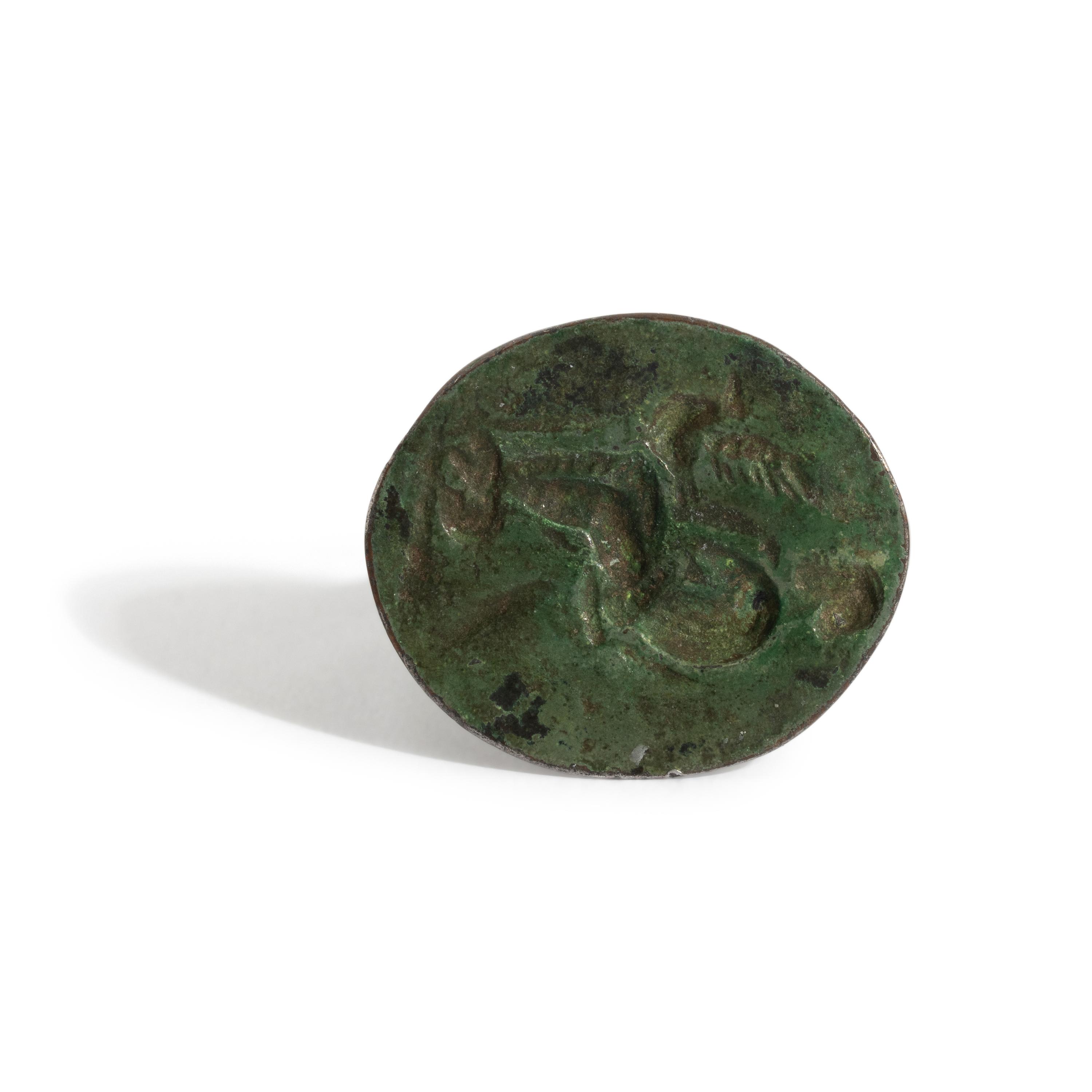 A Greek Bronze Finger Ring with Leda and the Swan or Aphrodite and her Dove