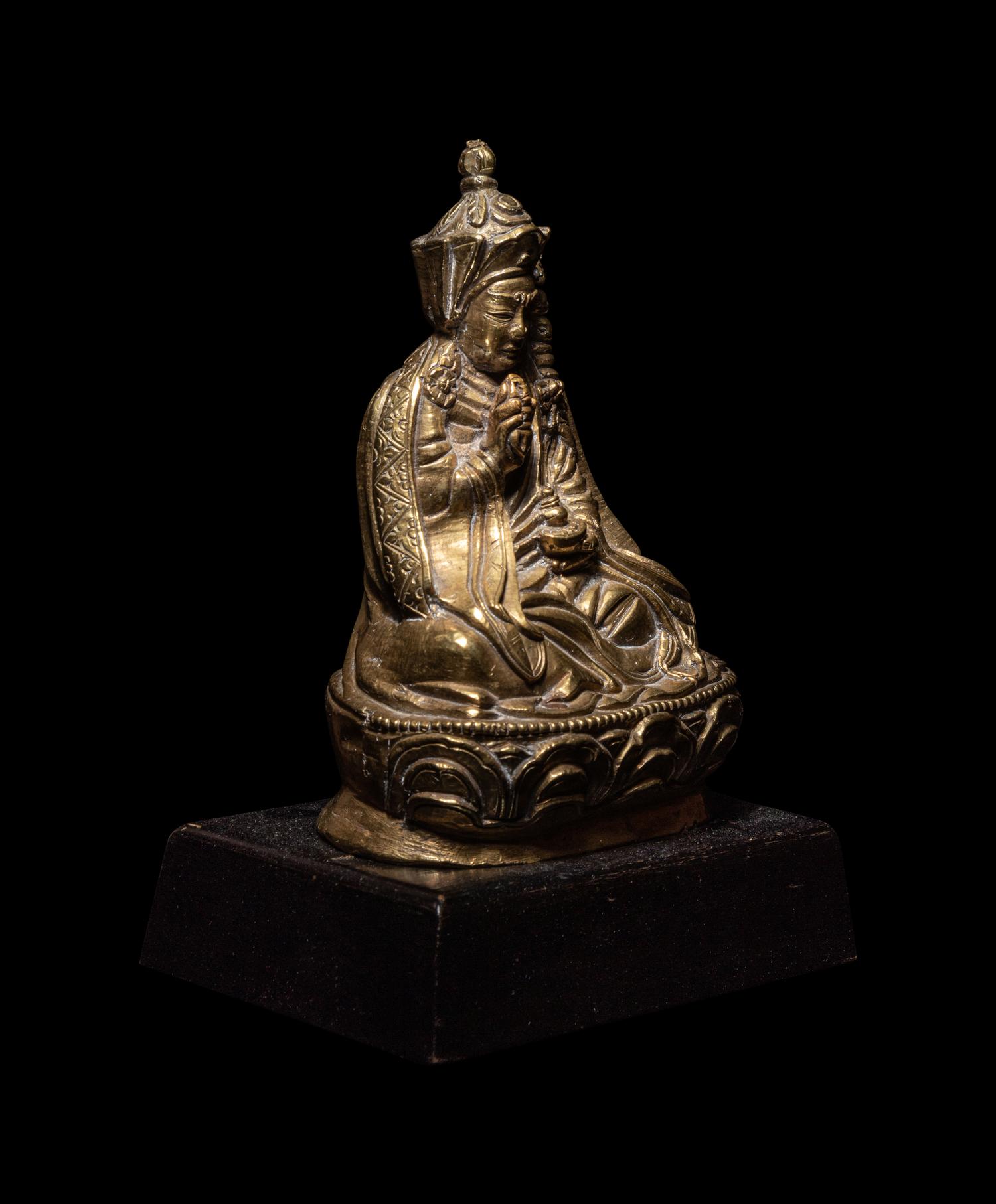 A Tibetan Gilt Bronze Figure of a Priest