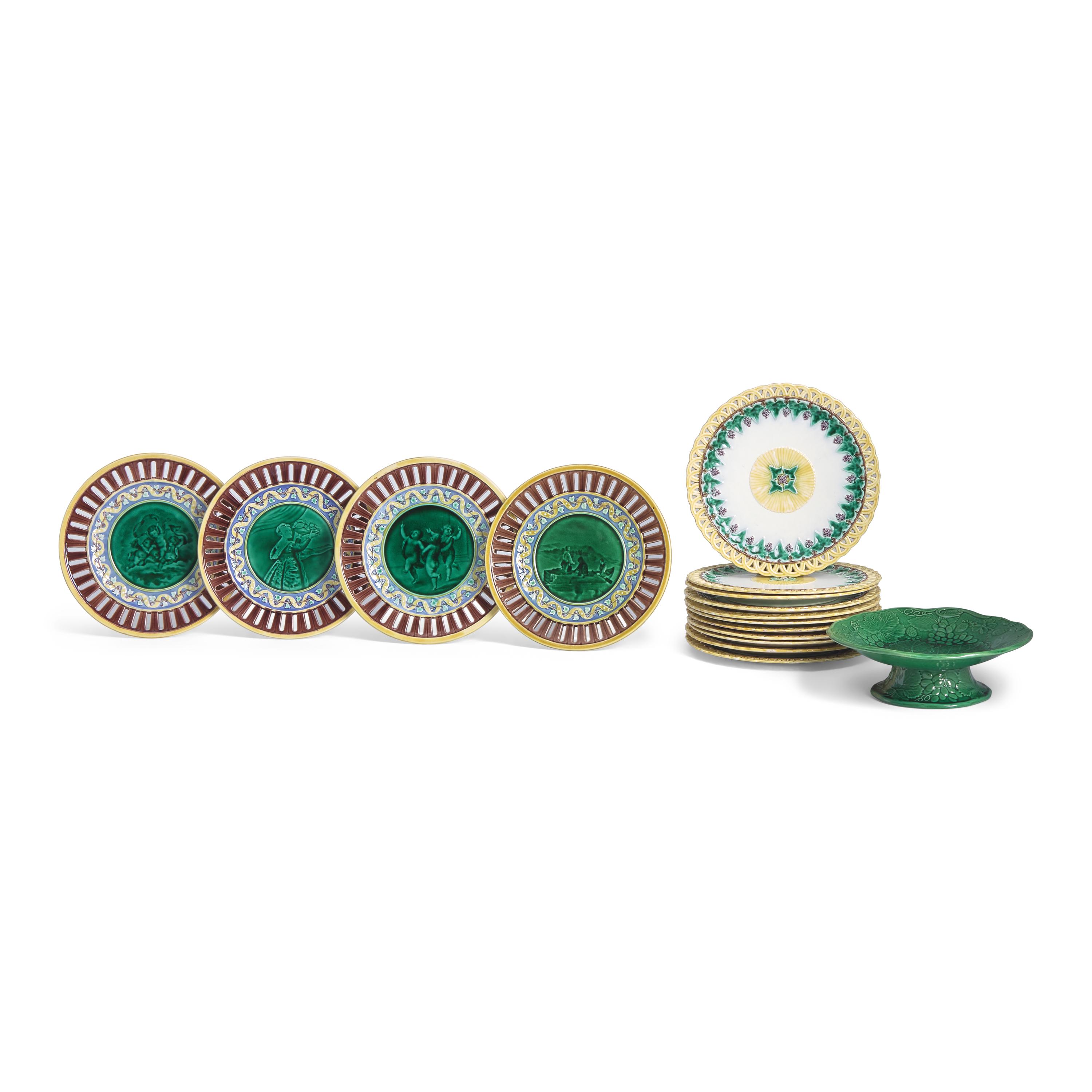 An Assembled Group of Wedgwood Majolica Plates Together with Footed Compote