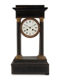 A Charles X Ebonized Mantel Clock
