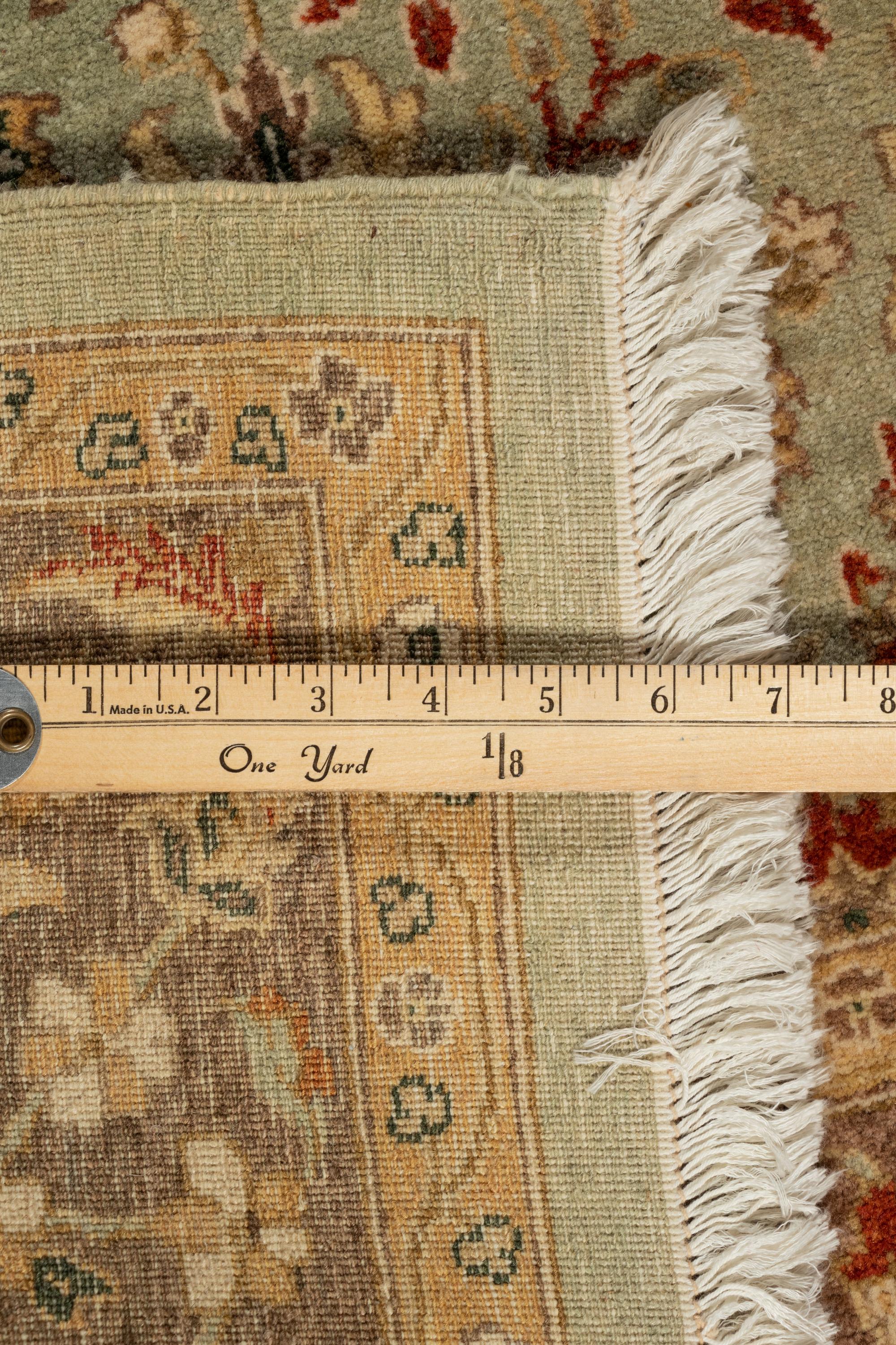 An Agra Design Wool Rug