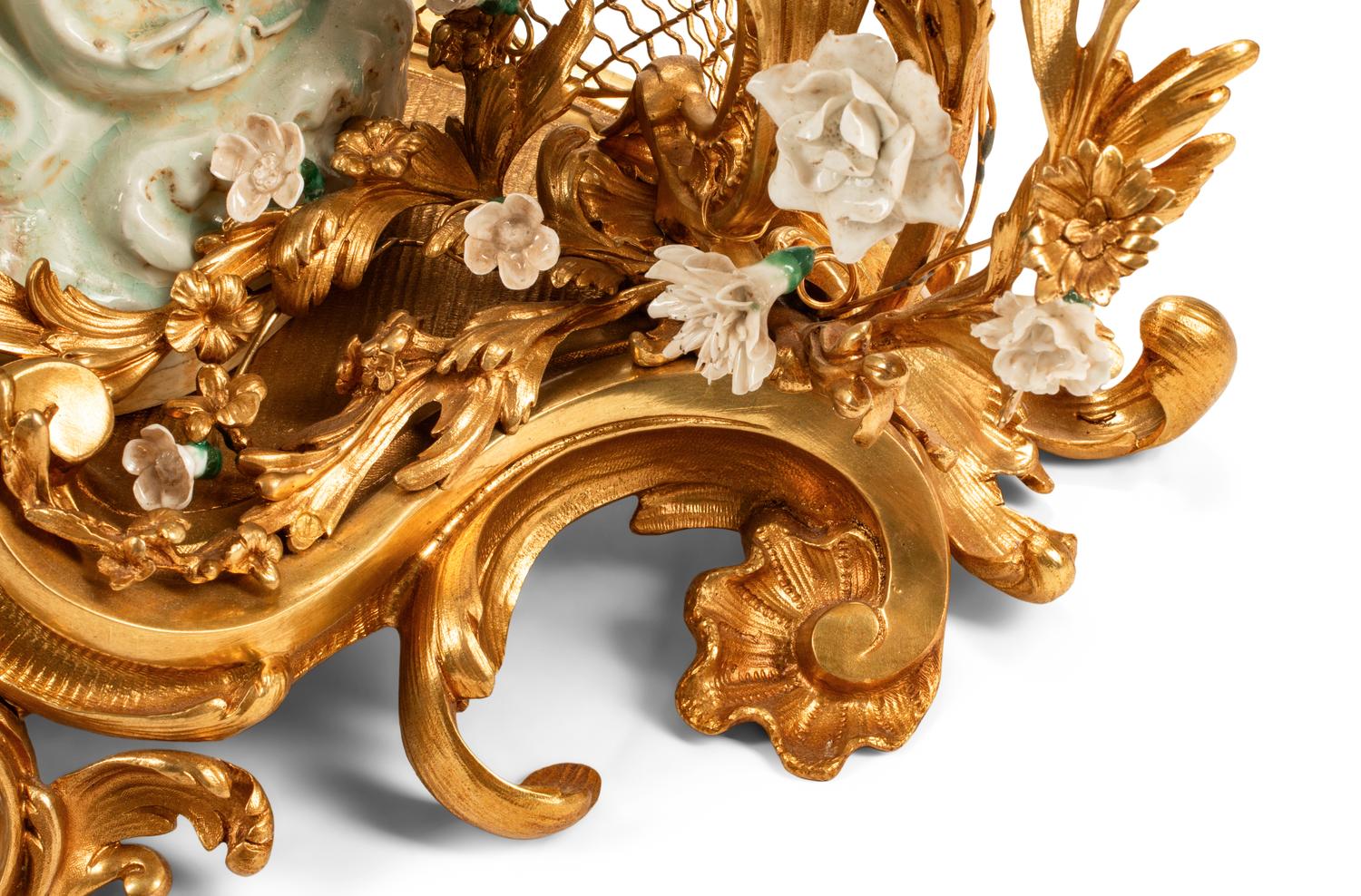 A Large Louis XV Style Gilt Bronze and White Porcelain Clock