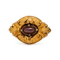 VICTORIAN, YELLOW GOLD AND GARNET MOURNING BROOCH