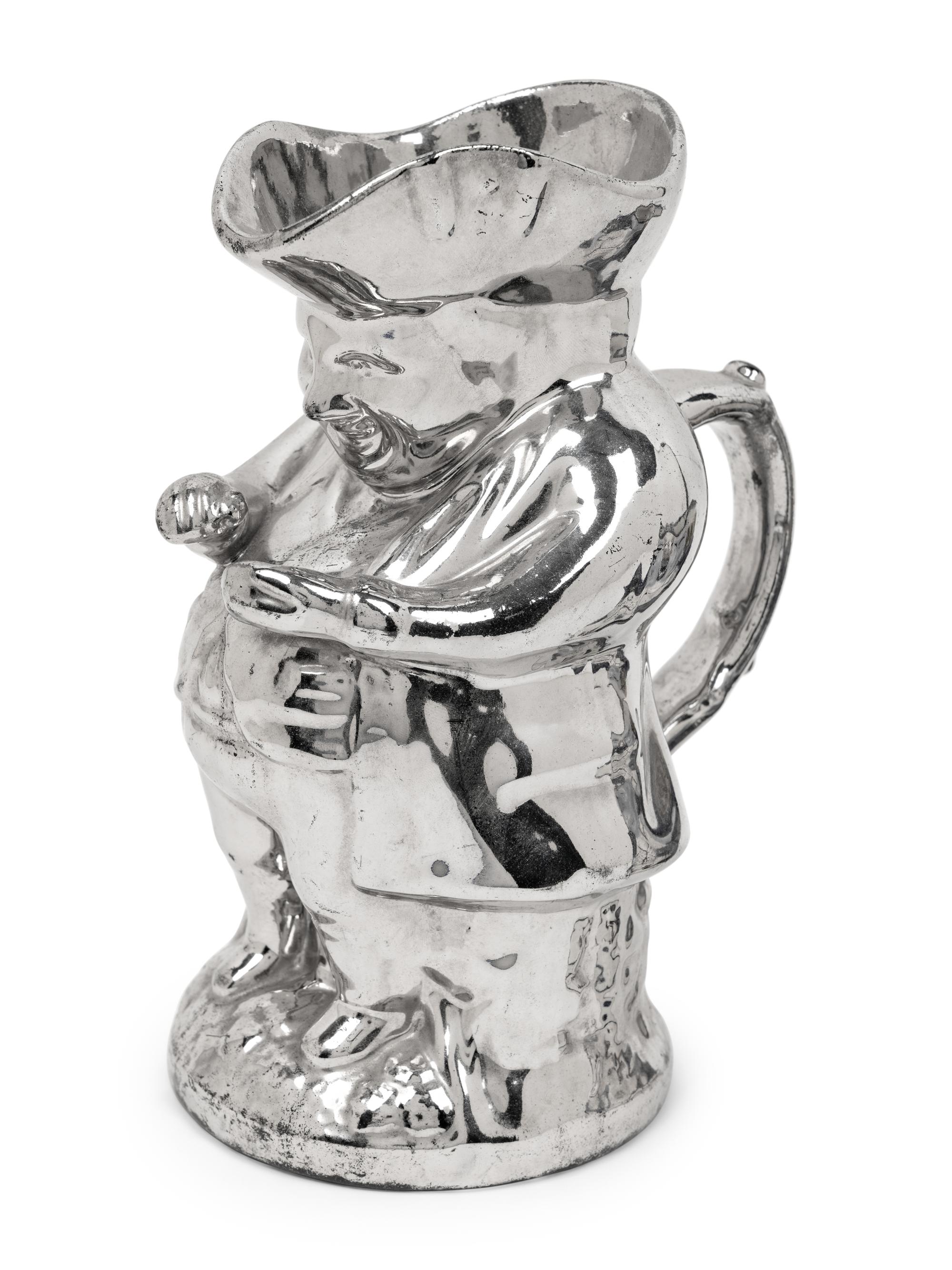 A Staffordshire Squat Toby Jug and a Silver Luster "Snuff Taker" Toby Jug