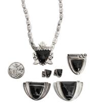A Group of Mexican Silver and Onyx Jewelry, Frederick Davis (1880-1961) Largest brooch: 1 7/8 x 2 3/4 inches.