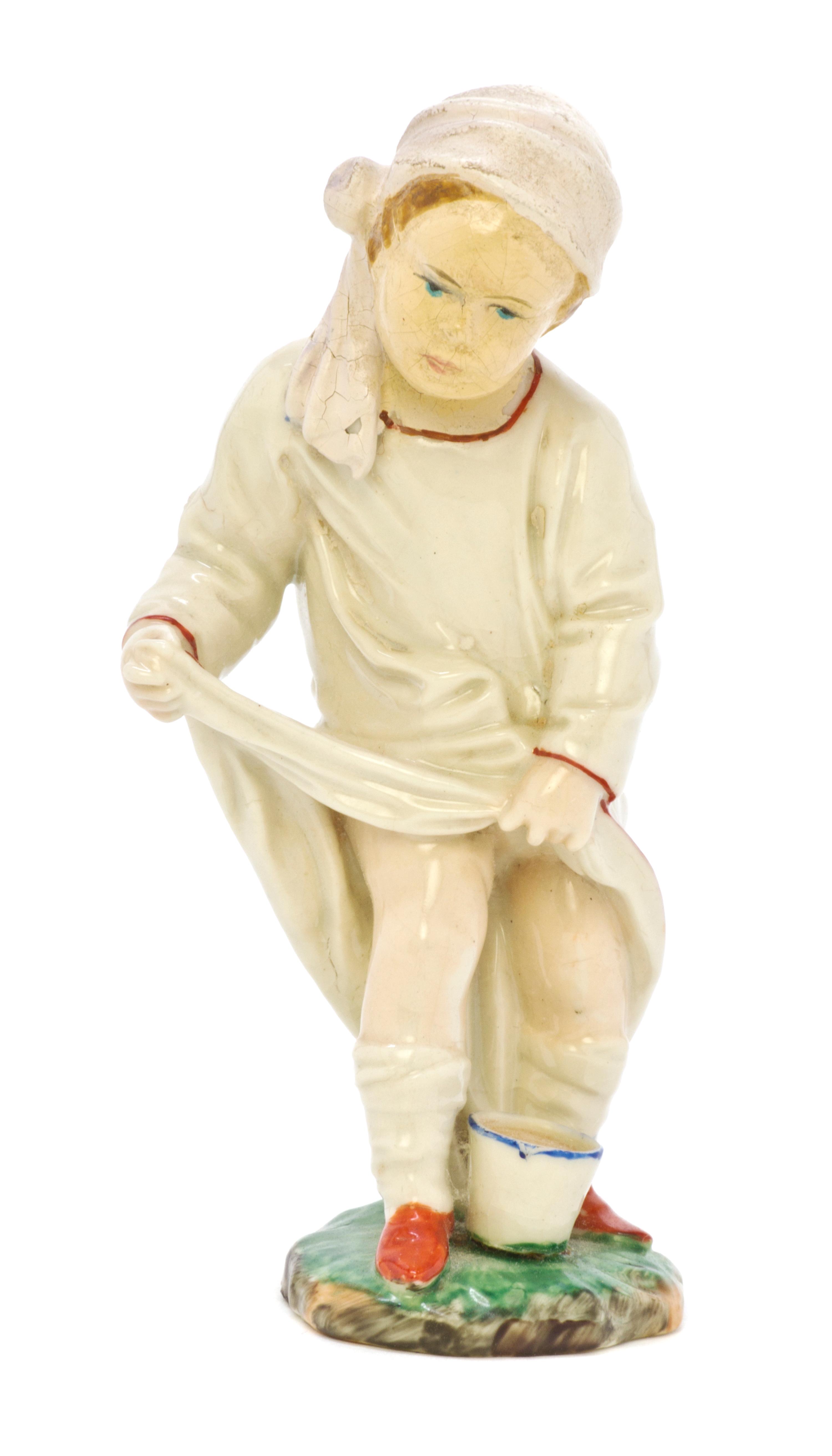 A Hoscht Porcelain Figure, Height 4 1/4 inches.