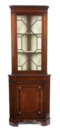 A Chippendale Style Mahogany Corner Cabinet Height 71 1/4 x width 25 1/2 inches.